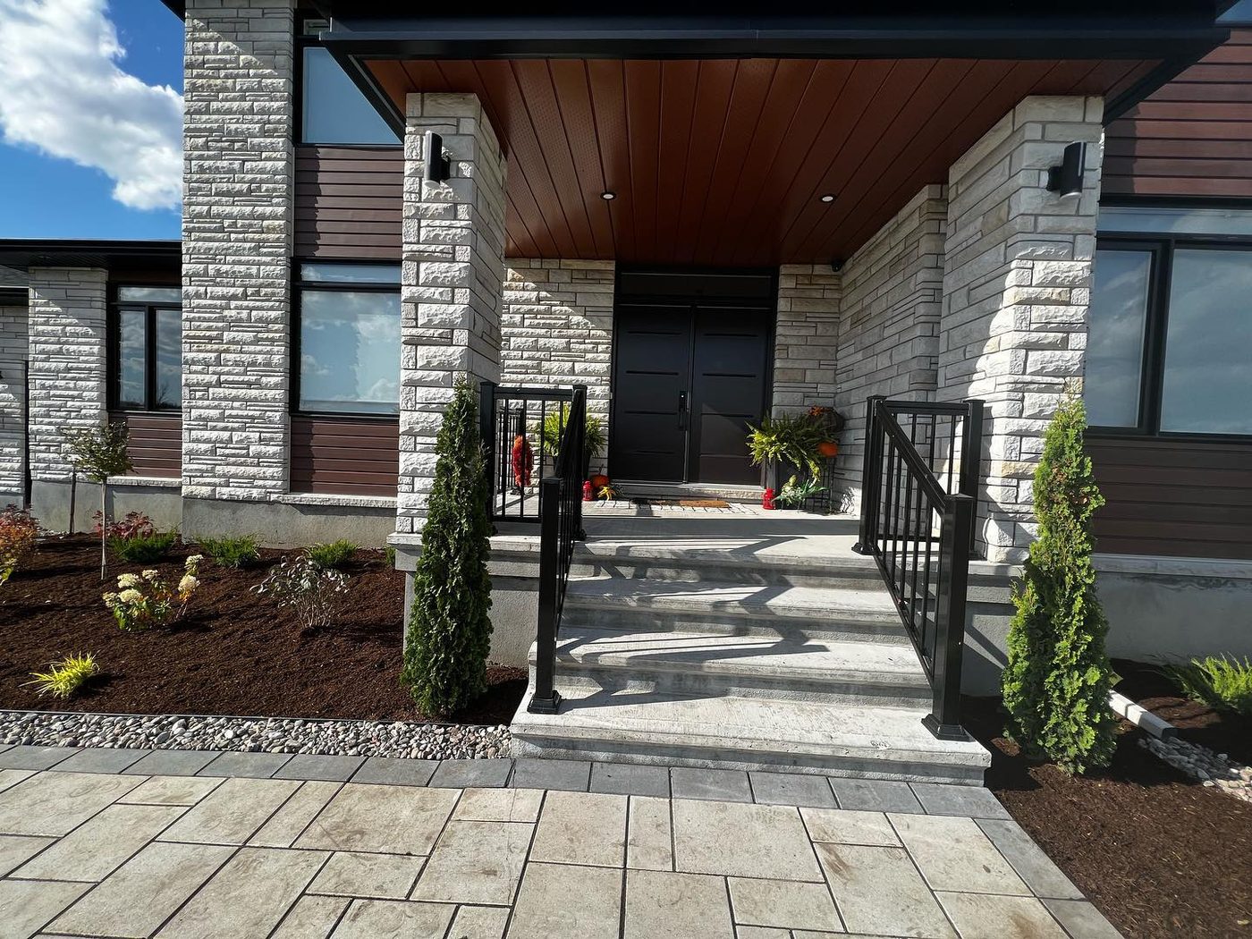 Modern stone home with new landscape installation